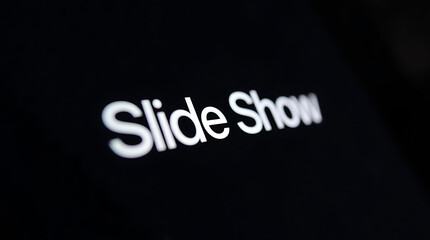 Dark background slide showing the words Slide Show in bright white, high contrast, blurred, cinematic feel, typography stands out; 4K HD