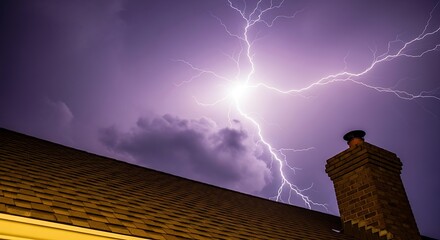 A dramatic lightning bolt strikes near a house chimney during a severe thunderstorm