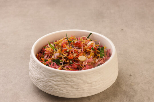 Sambal Matah with ikan teri or anchovy is a traditional Balinese raw chili relish made from sliced shallots, red chilies, lemongrass, and kaffir lime leaves, mixed with coconut oil and lime juice. 