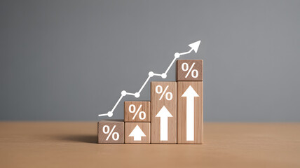 Brown wooden blocks with white percent signs and arrows on a table