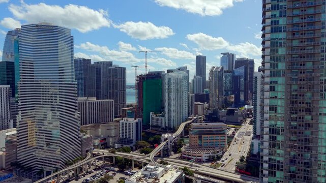 Downtown Miami traverse to Brickell over Miami River. 2026 aerial drone establishing shot