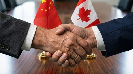 Business and diplomatic handshake between China and Canada with national flags
