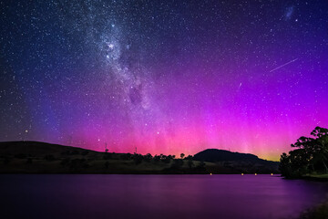 A Pink Aurora Australis and the Milky Way Shimmers Over the Dam