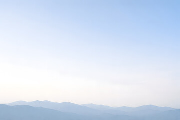 Obraz premium A clean and calm mountain scene with large empty sky area, specifically composed for text overlays and marketing use