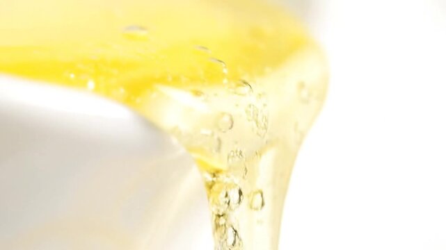 Close-up of golden liquid with air bubbles