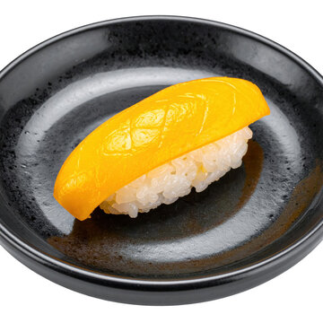A serving of mini tamagoyaki nigiri sushi on a dark plate, perfectly isolated on a bright white background