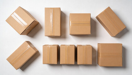 A collection of cardboard boxes on a white surface for shipping and storage