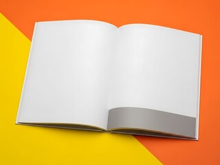 An open book lies on a bright orange and yellow surface viewed from directly above