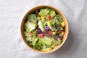 Healthy vegetable salad in takeout bowl, Top view