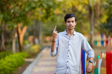 indian indian man showing voting sign