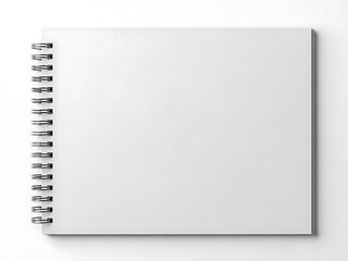 A top-view photograph of a blank white spiral-bound notebook on a plain white surface with subtle shadowing