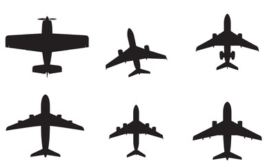 Collection of diverse airplane silhouettes viewed from above, isolated on white.