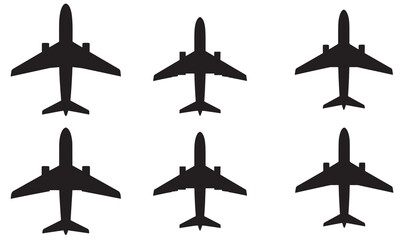 Group of six identical black silhouettes of passenger jet airplanes from above.