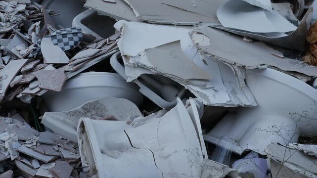 Close-up of Mixed Construction Waste Including Tiles Wood and Gypsum Board