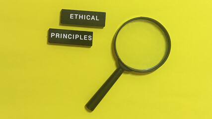 Examining ethical principles with a magnifying glass to represent analysis and scrutiny in business and professional contexts