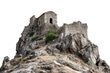 Ancient stone castle ruins perched on a rocky mountain isolated on transparent background. Ancient stone castle ruin on rocky cliff landscape scene isolated on white background.