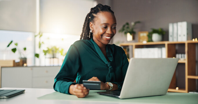 Credit card, laptop and black woman in office for online shopping, internet banking and payment. Fintech, workplace and person on computer for purchase, business transaction and company expense