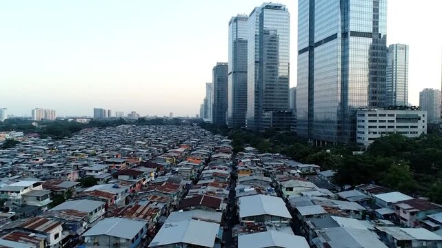 Urban sprawl contrasts dense shantytown with modern skyscrapers