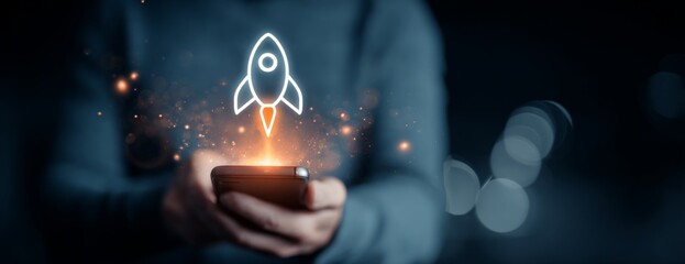 Man holding smartphone with rocket symbolizing digital business launch  
