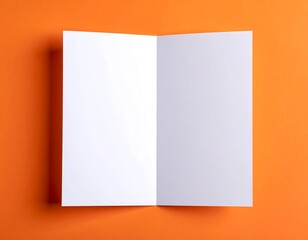 Blank brochure on orange background