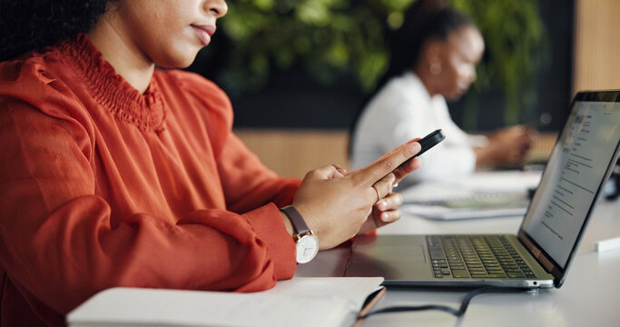 Woman, hands and phone in office with laptop, text message and email for social media marketing campaign. Creative, person and coworking with computer, tech and notification for digital advertising.