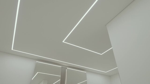 Abstract view of white ceiling with recessed linear LED lights