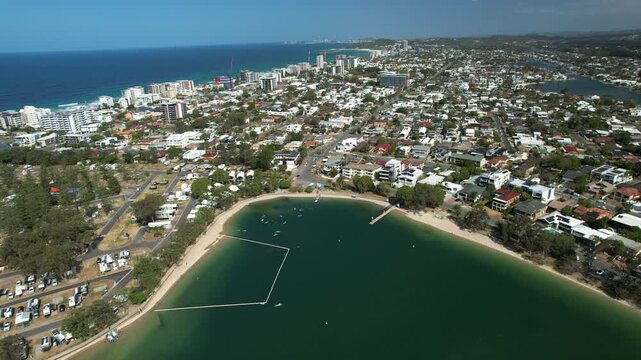 Tallebudgera Estuary Floating Boom - Palm Beach Coastal Suburb In QLD, Australia. - aerial shot