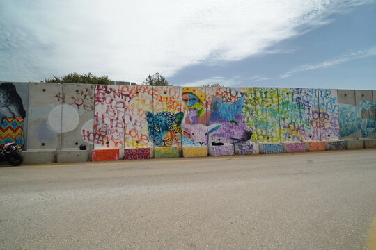 border wall of Israel and Lebanon with graffiti  of peace and co existence on the Israeli side near the settlement of Shtula 