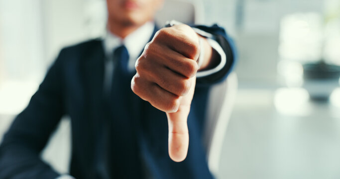 Businessman, hands and refusal with thumbs down for feedback, disapproval or deny in office. Closeup, man or employee with dislike emoji, no sign or wrong dismissal for negative results or rejection