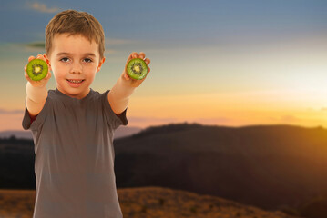 A young boy is pointing at a construction site