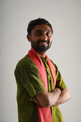 happy young indian farmer standing on white background