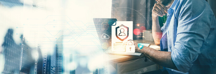Advanced Cyber Security and Personal Data Protection Concept, Professional Working on Laptop with Secure Profile and Shield Overlay.
