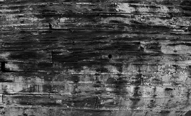 Obraz premium Wooden boat hull with weathered colours and textures