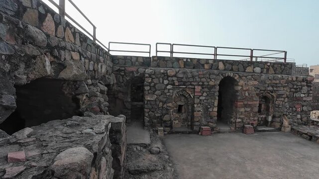 Detailed View of the Weathered and Ancient Stone Ruin Walls Featuring Traditional Medieval Masonry Inside the Firoz Shah Palace Complex in Hisar