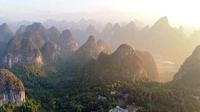 Sunrise aerial view of karst landscape near Xianggong Mountain, Yangshuo, Guilin, China