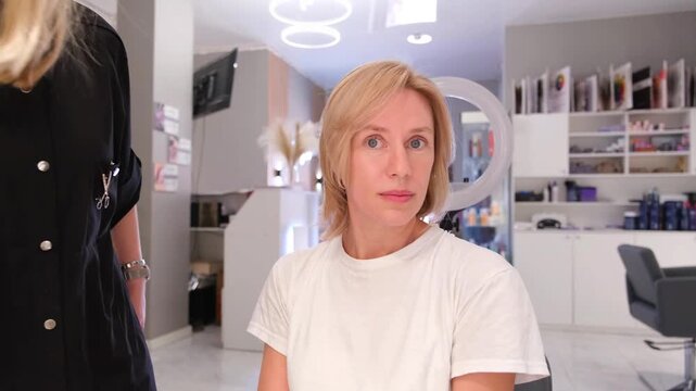 Moscow, Russia, 24.04.2025 Caucasian woman in salon for new hair look. Transformation highlights footage.