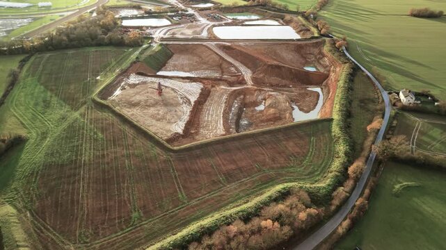 Aerial View Of Construction Site For Flood Management With A Screener Machine.