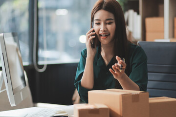 Starting small businesses SME owners female entrepreneurs check online orders to prepare to pack the boxes, sell to customers, sme business ideas online.