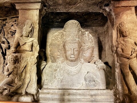 Ancient rock cut cave temple and monumental Shiva sculpture inside Elephanta Caves on Elephanta Island near Mumbai India