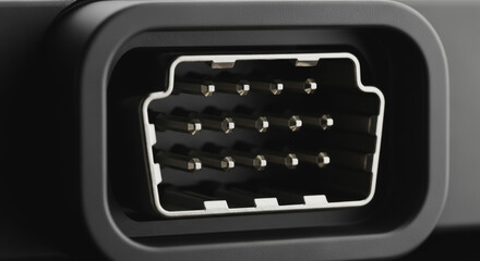 Macro view of a multi-pin male diagnostic connector, black plastic housing, detailed electronic connection port for high-speed data communication, technology, and automotive systems interface.