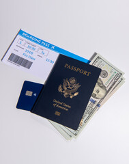 US passport with boarding pass and credit card. Travel documents for airport check in and international flight concept. American passport visa and border control theme. Boarding pass and payment card. © Svitlana