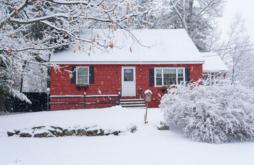 red winter house in snow
