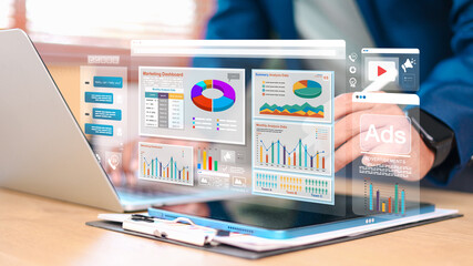 Digital marketing analytics and online advertising concept with business dashboard, charts and ads interface on laptop and tablet. Data driven marketing, performance analysis and strategy.