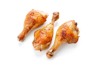 Grilled chicken legs on white background.