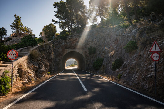 Mountain Road Leading to Tunnel in Mallorca&rsquo;s Rugged Interior