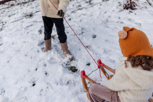 Winter Sled Pull Through Snowy Landscape