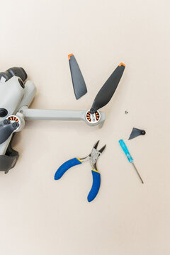 Drone maintenance repairing broken propeller with tools