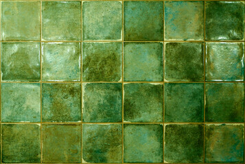 Green ceramic tile background. Old vintage ceramic tiles in green to decorate the kitchen or bathroom