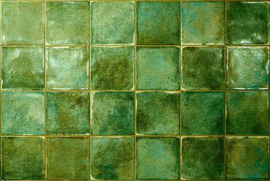 Green ceramic tile background. Old vintage ceramic tiles in green to decorate the kitchen or bathroom