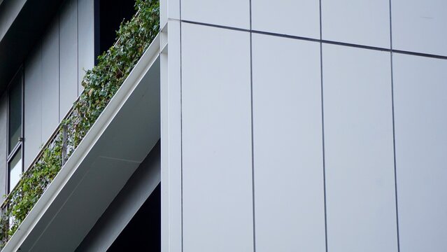 Closeup of contemporary metal panel cladding on a budling in Tokyo Japan